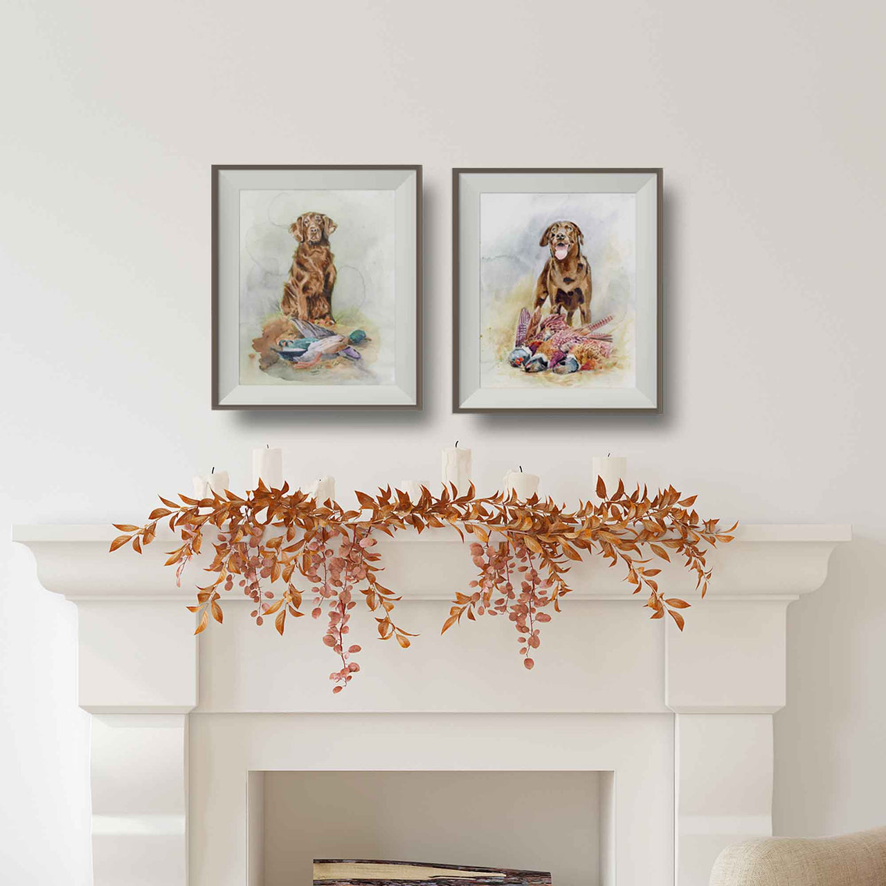lifestyle mockup of chocolate labrador with duck and chocolate labrador with pheasants matted and framed over a white fireplace 