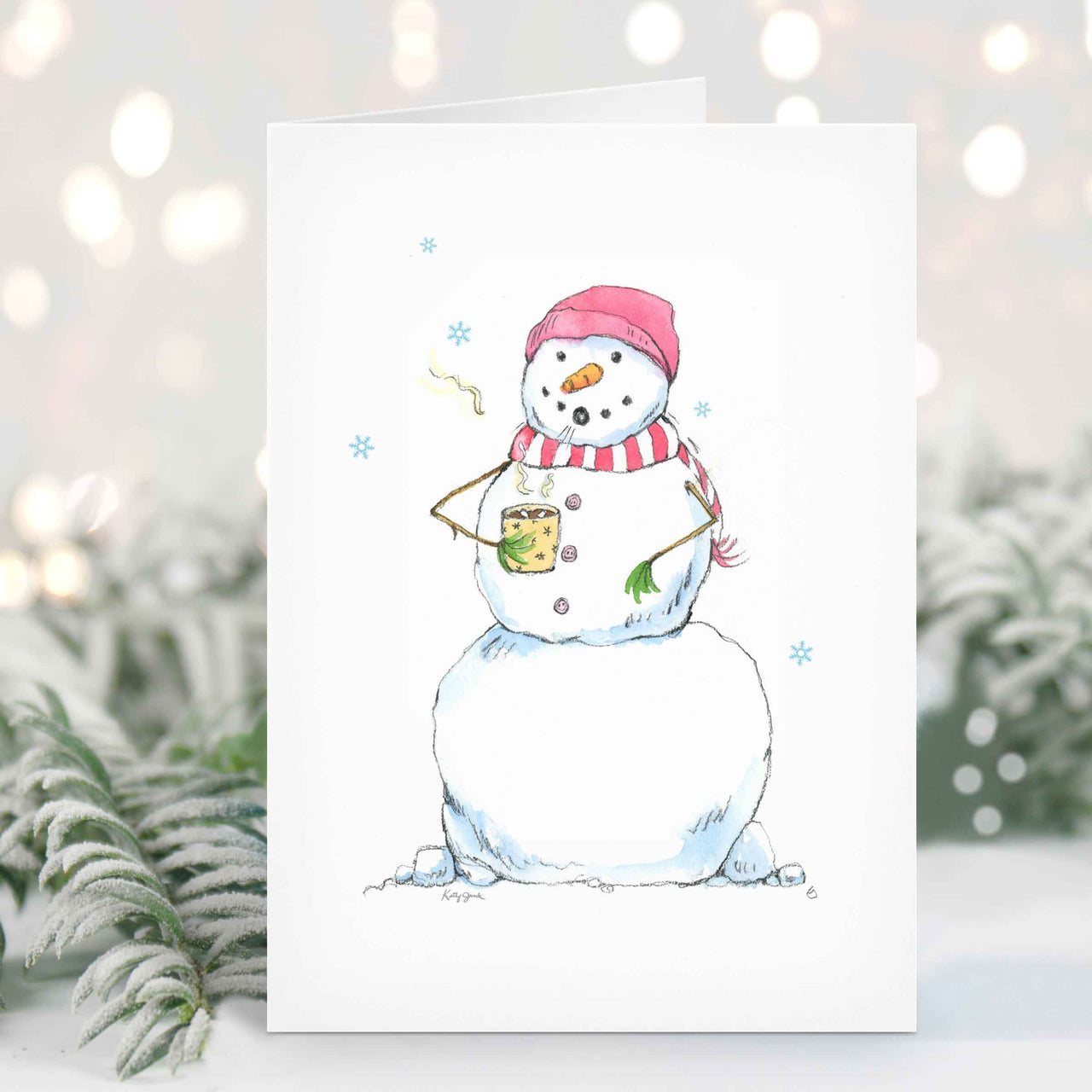 a card with a snowman wearing a red and white hat