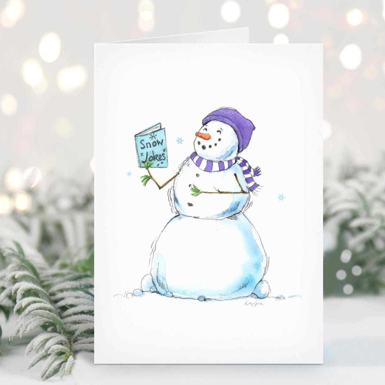 a card with a snowman holding a sign