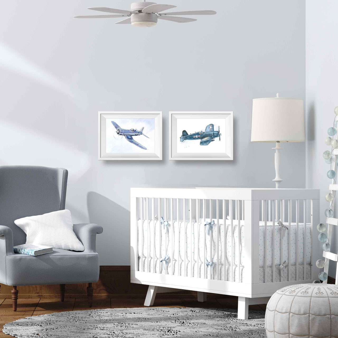 lifestyle mockup of a baby boy's nursery in light gray and white with two corsair airplane prints in white frames