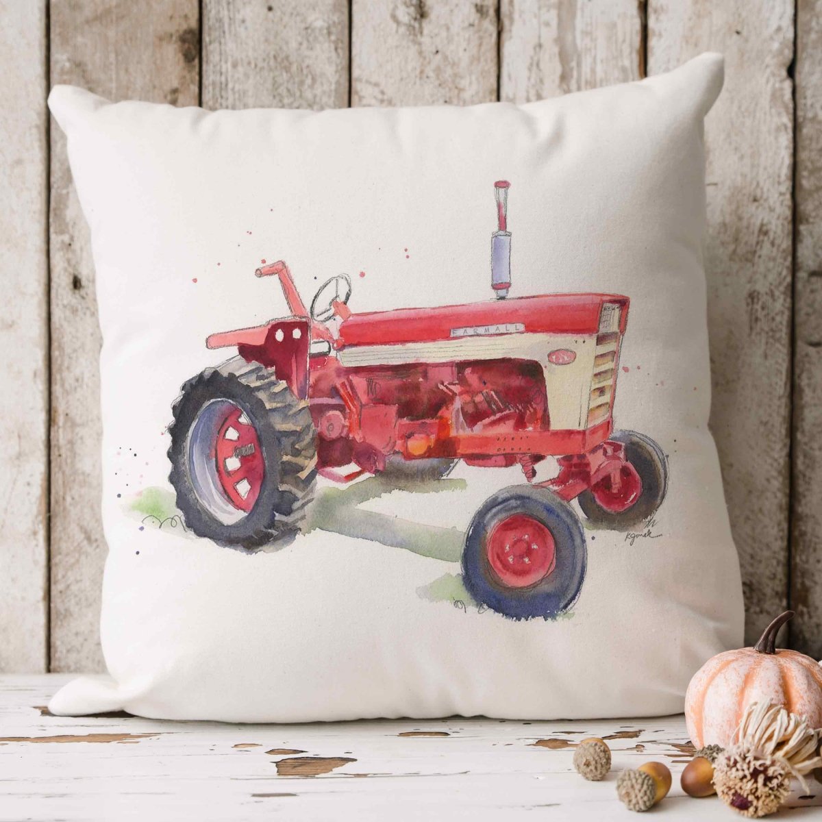 mockup of farmall red tractor watercolor design on 18 x 18 inchthrow pillow 